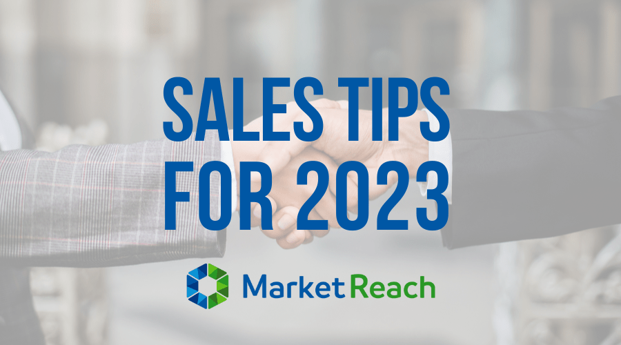 Two hands shake. The words "sales tips for 2023" are overlay the picture.